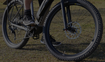 Close-up view of an electric bicycle with emphasis on the tires and frame.